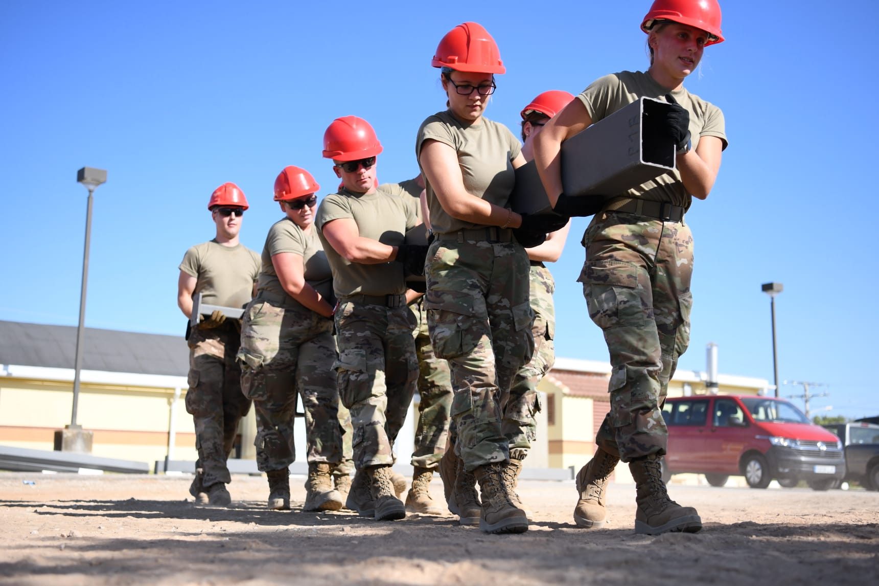RED HORSE members in uniform at a construction site