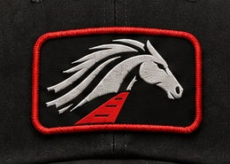 Silver horse patch artwork as shown on the hats
